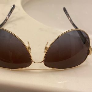 Tory Burch Aviator sunglasses preowned but never worn.